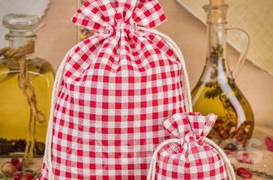 Fashionable red checkered linen bags make a great decoration for a kitchen counter or shelf