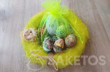 Hand-painted Easter eggs in neon green organza pouches.