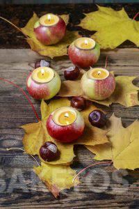 An autumn DIY candle holder made from apples