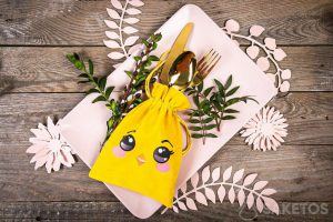 A yellow velour cutlery pouch - chicken print