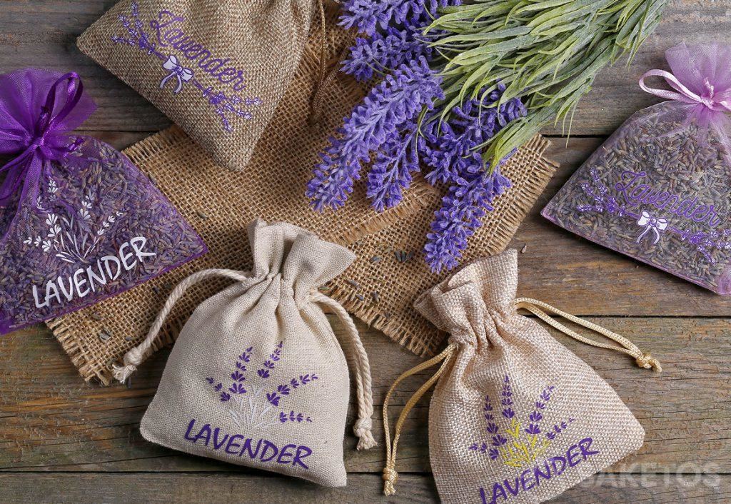 Organza, jute and linen bags with lavender printed on them and filled with its dried flowers.