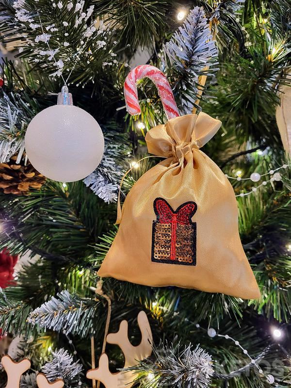 Christmas tree decorations with gifts - a bag with a lollipop