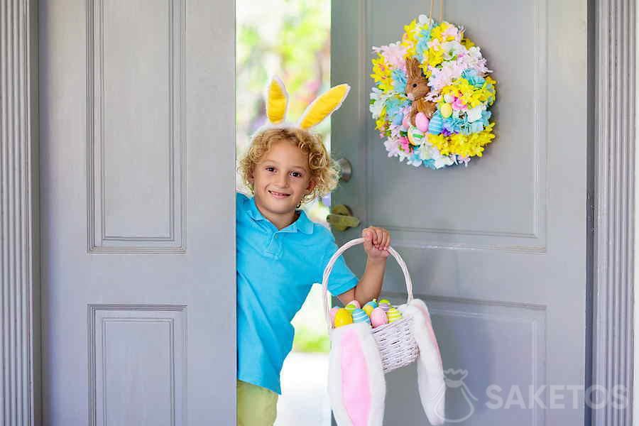 A wreath in pastel colors on the entrance door