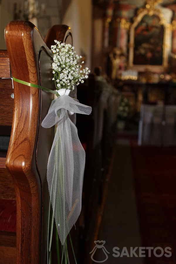 Bouquet of gypsophila flowers - decoration for a bench in the church