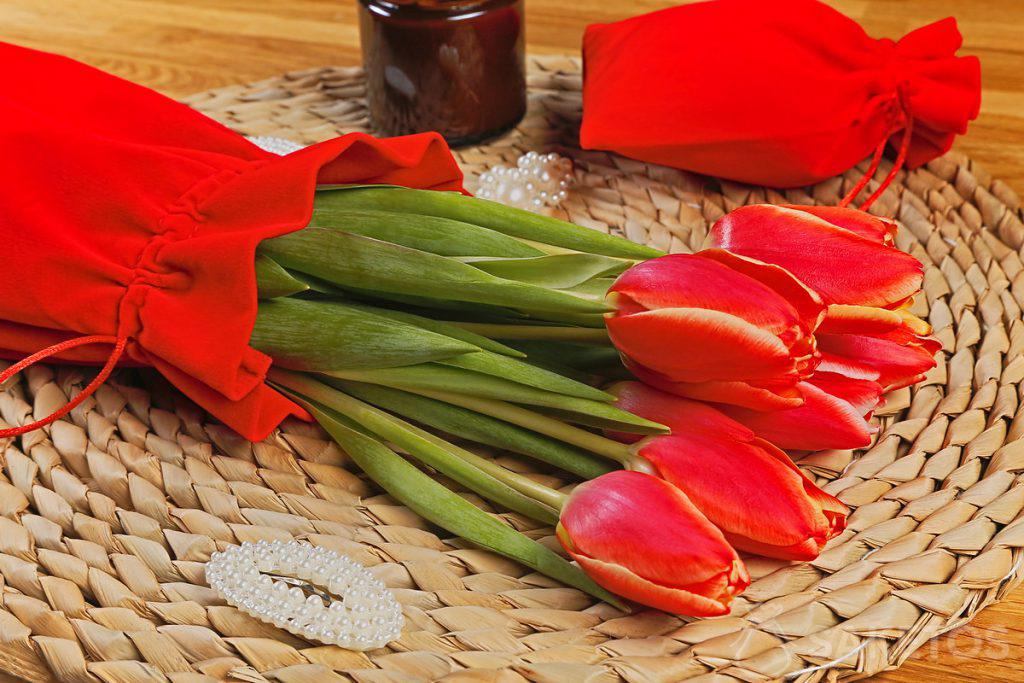 A bouquet of tulips in a velour pouch