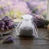 White organza pouches filled with dried lavender for wardrobe fragrance.