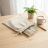 Linen bags as eco-friendly packaging for notebooks and souvenirs.