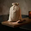 Linen bags with bath salt in a relaxing SPA setting.