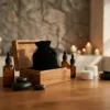 Essential oils and spa accessories neatly packed in soft black velvet pouches.