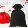 Festive red bauble and a black velvet pouch for small Christmas surprises.