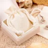 Eco-friendly gift packaging using cotton bags.
