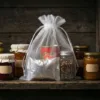 Organza pouch white used as an organizer for dry products in a pantry.