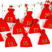 Advent calendar, 24 pcs velvet pouches 12 x 15 cm - red 33 Velvet pouches 6 x 8 cm - silver Velvet pouch
