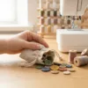 Linen pouch with colourful buttons for sewing.