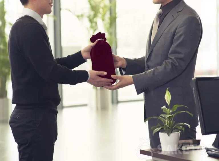 Alcohol packaged as a gift in a velour bag