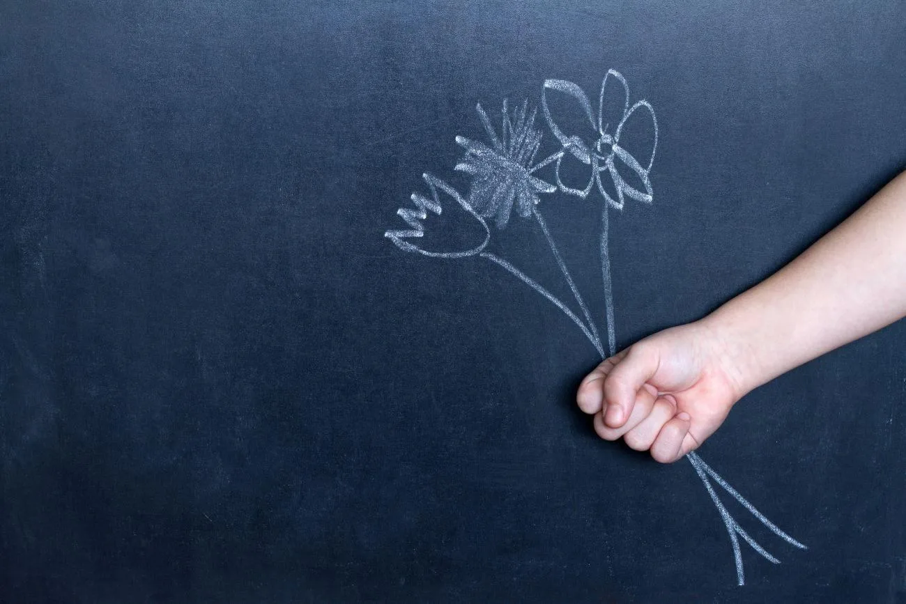 Gifts for teachers, packed neatly, drawing on the blackboard