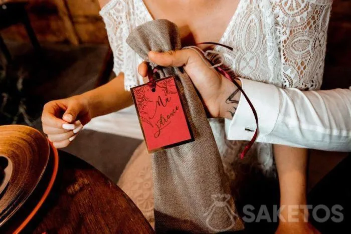 A jute bag as a packaging for a bottle of alcohol