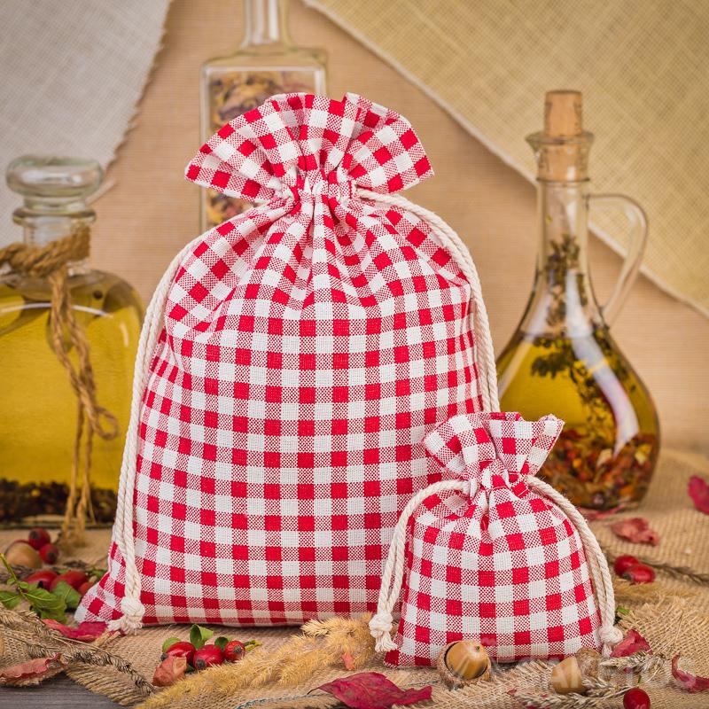 Fashionable red checkered linen bags make a great decoration for a kitchen counter or shelf