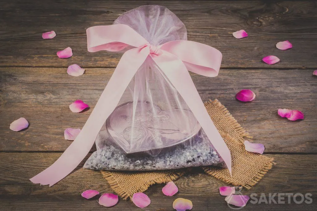 A decorative ribbon bow attached to an organza bag