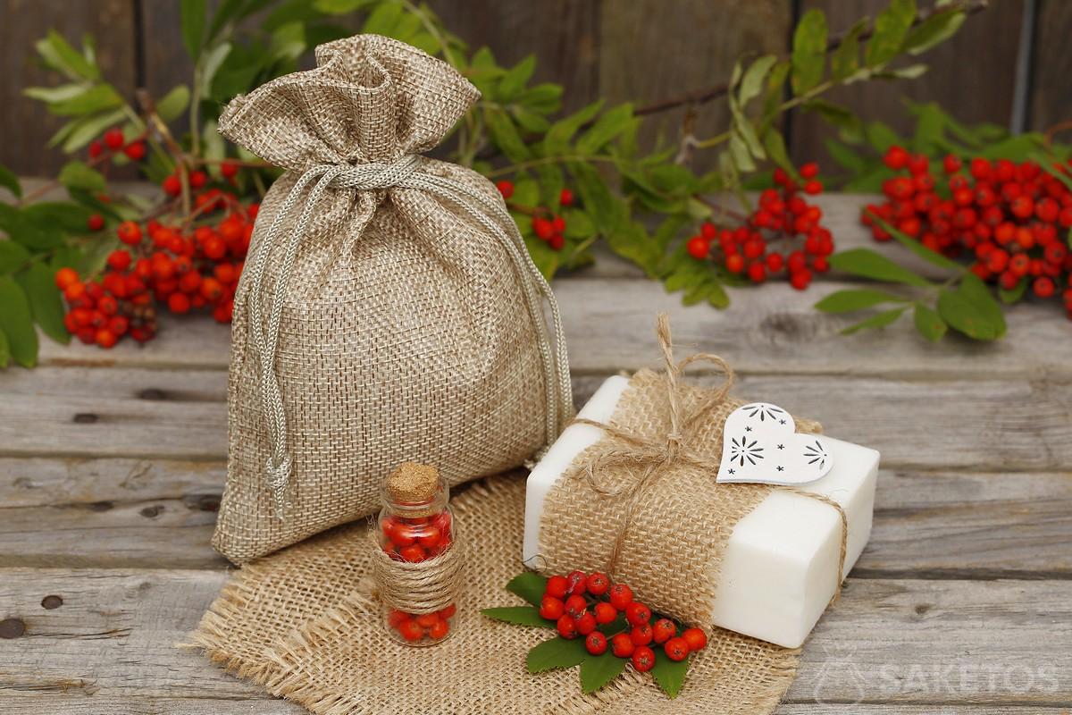 Packaging natural soaps in jute bags.