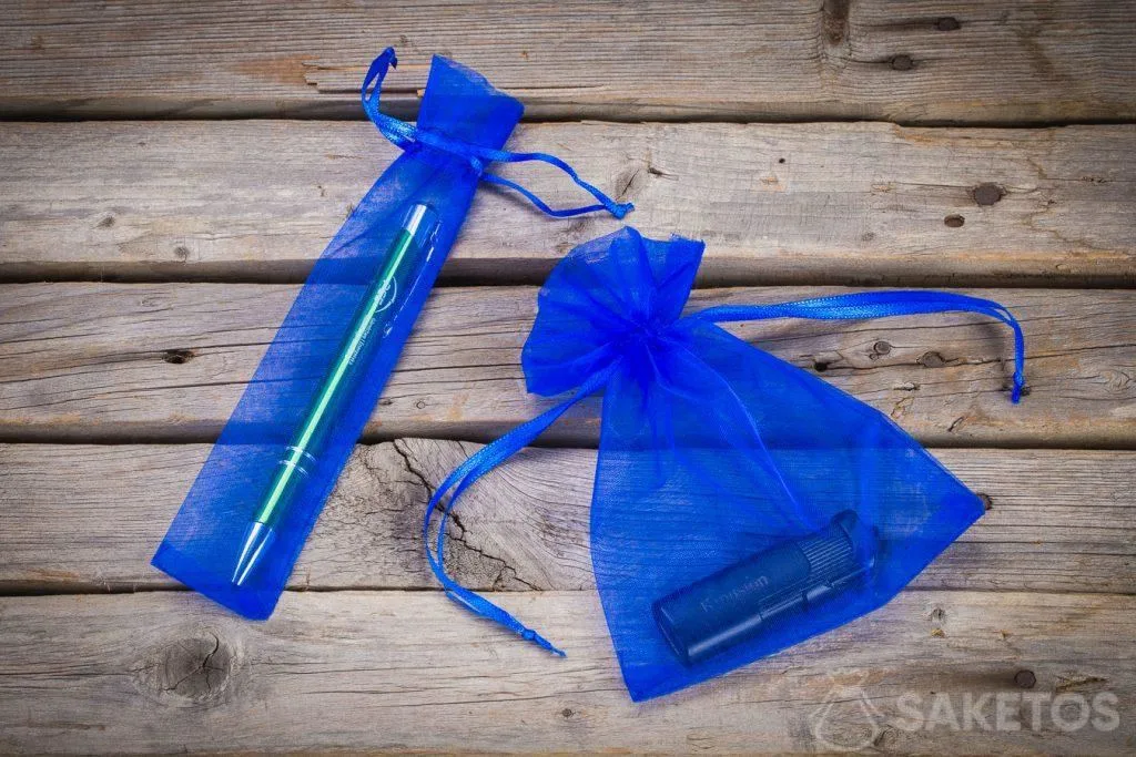 Blue organza bags as packaging for advertising gadgets