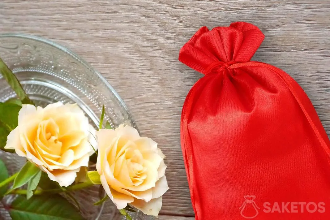 Red satin pouch and roses