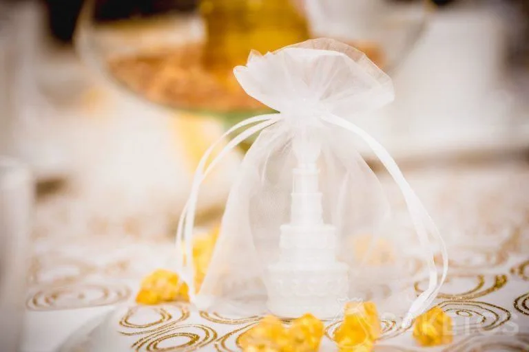 Decorative table elements packaged in organza bags