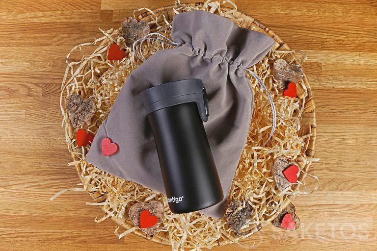 A velour bag and a thermal mug