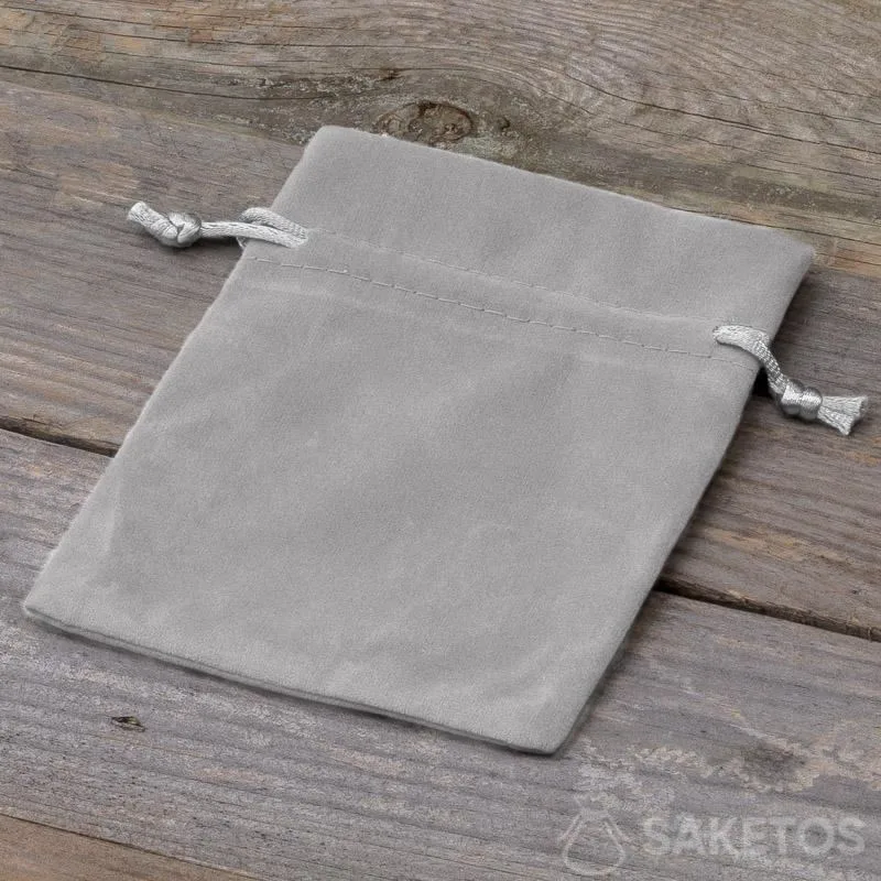 A decorative bag made of grey velour