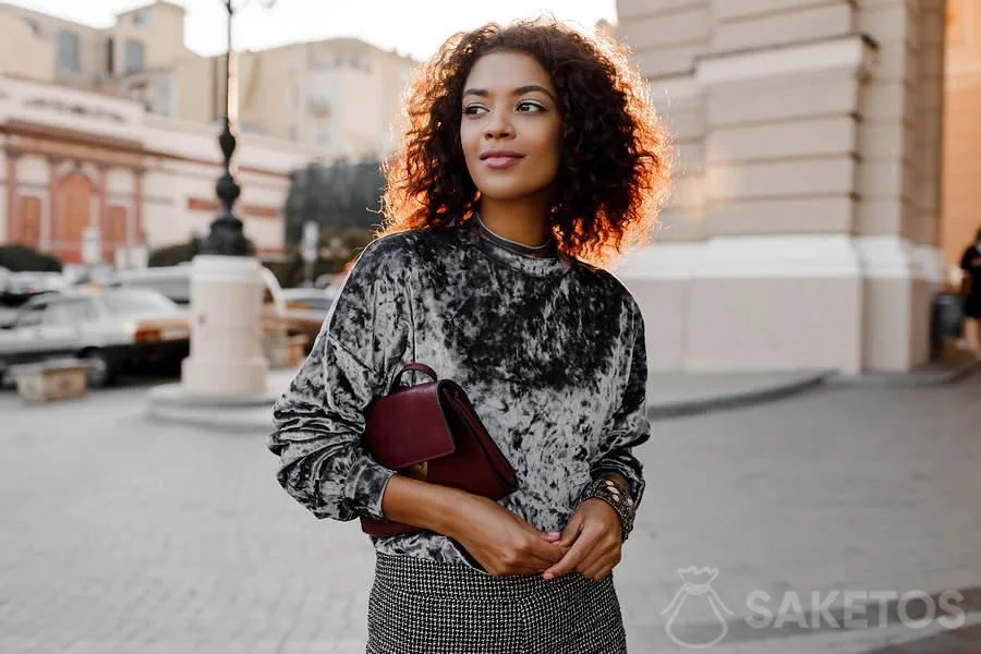 5.A young woman wearing a velour sweatshirt