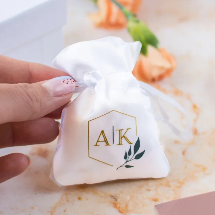 Homepage 45 White satin bag with gold print for weddings