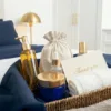 Linen bags in basket on bed for cosmetic packaging and thank you gifts