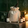 Linen bags with essential oils and candles - natural spa and aromatherapy packaging