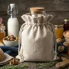Linen bags for storing jars and food products on a wooden kitchen table