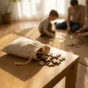 Linen bags as packaging for wooden puzzles on a table during family play