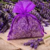 Organza bags tied by hand as packaging for dried lavender on a wooden table