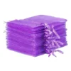 Stack of purple organza bags prepared for gift and product packaging