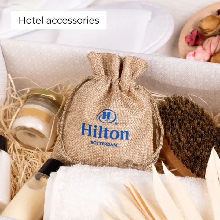 Custom jute bags with Hilton logo, premium packaging for hotel amenities and guest supplies.